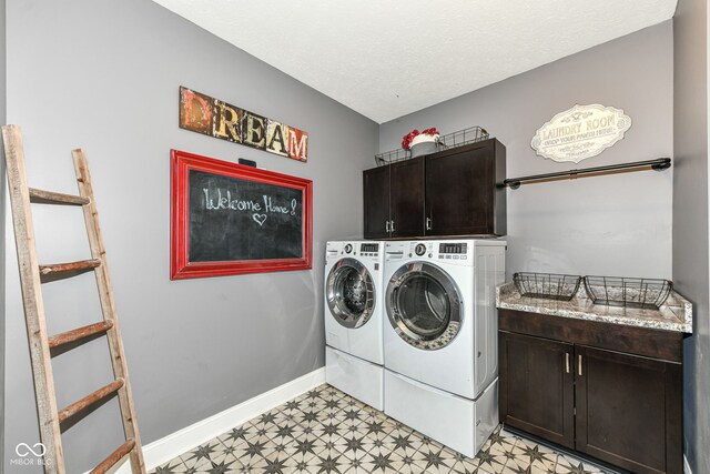 561 Farnham Dr, Westfield, IN 46074 - washroom featuring cabinet space, light flooring, washer and clothes dryer, and a textured ceiling