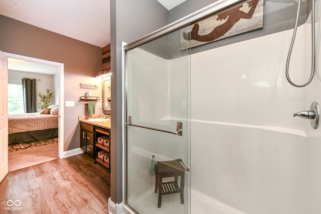 561 Farnham Dr, Westfield, IN 46074 - ensuite bathroom featuring a shower stall, wood finished floors, and vanity