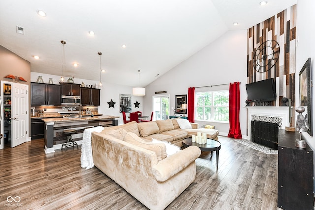561 Farnham Dr, Westfield, IN 46074 - living area with wood finished floors, high vaulted ceiling, recessed lighting, and a fireplace