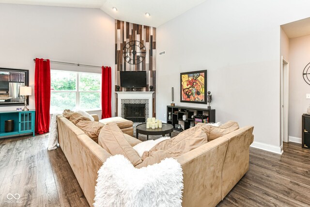 561 Farnham Dr, Westfield, IN 46074 - living area featuring high vaulted ceiling, dark wood-style floors, a tiled fireplace, and recessed lighting