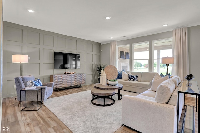 17030 Daly Dr, Noblesville, IN 46062 - living area featuring light wood-style flooring, ornamental molding, and recessed lighting