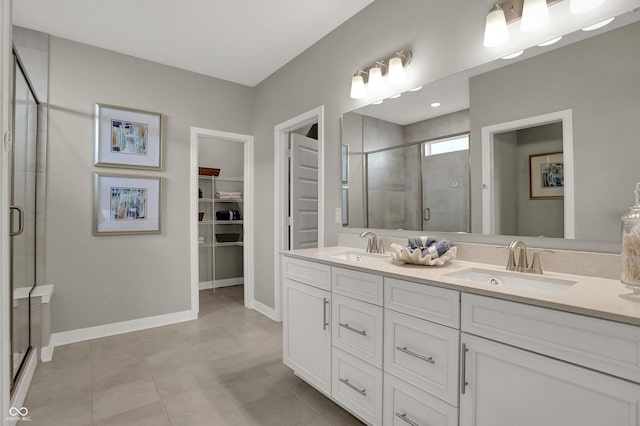 17030 Daly Dr, Noblesville, IN 46062 - bathroom with a shower stall, double vanity, tile patterned flooring, and a spacious closet
