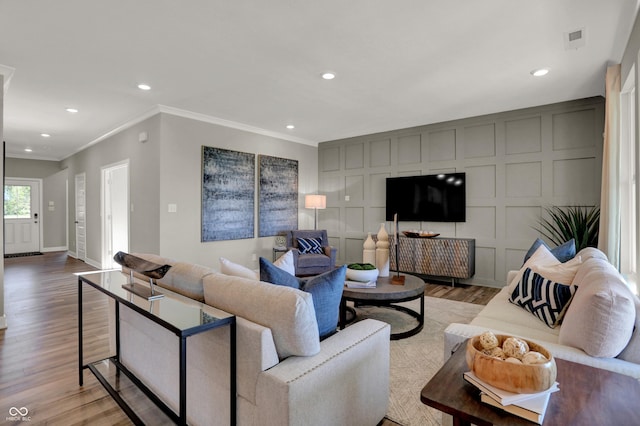 17030 Daly Dr, Noblesville, IN 46062 - living room featuring wood finished floors, ornamental molding, and recessed lighting