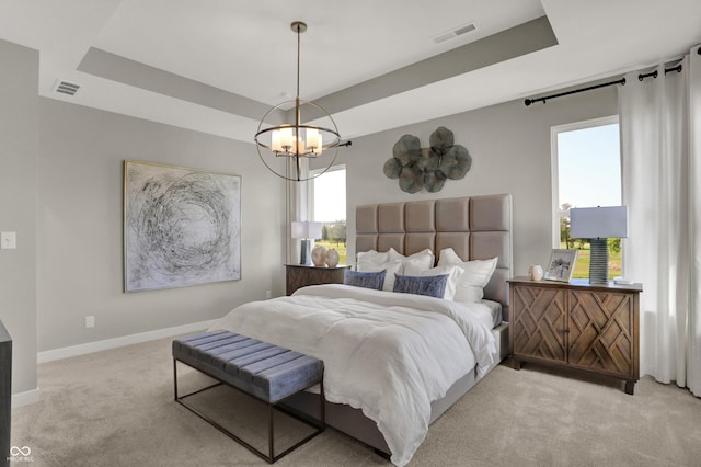 17030 Daly Dr, Noblesville, IN 46062 - bedroom featuring light colored carpet, a tray ceiling, and a chandelier