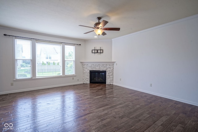 6471 W Clearview Dr, Mccordsville, IN 46055 - unfurnished living room with ceiling fan, dark wood finished floors, crown molding, and a stone fireplace