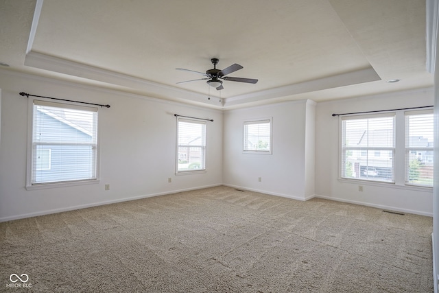 6471 W Clearview Dr, Mccordsville, IN 46055 - carpeted empty room featuring a tray ceiling, ornamental molding, and a ceiling fan