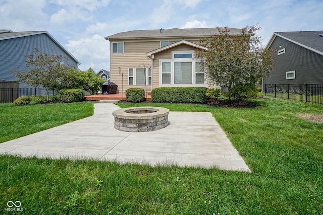 6471 W Clearview Dr, Mccordsville, IN 46055 - back of property with a fire pit, a patio area, and a deck