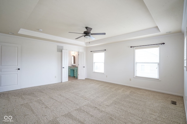 6471 W Clearview Dr, Mccordsville, IN 46055 - unfurnished bedroom featuring a raised ceiling, crown molding, light colored carpet, ensuite bath, and a ceiling fan