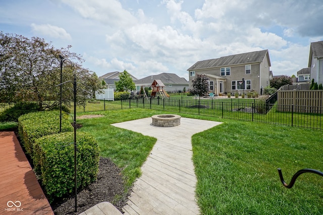6471 W Clearview Dr, Mccordsville, IN 46055 - fenced backyard featuring a fire pit, a residential view, and a playground