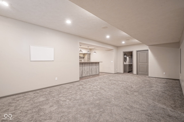 6471 W Clearview Dr, Mccordsville, IN 46055 - unfurnished living room with a bar, carpet, and recessed lighting