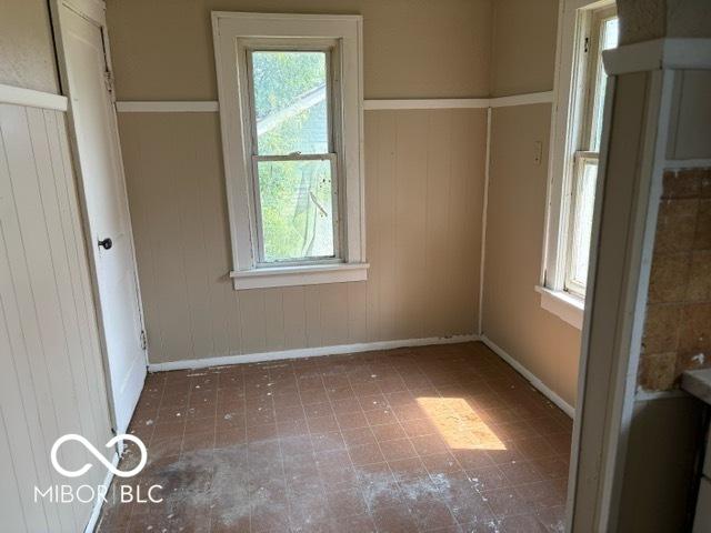 822 W 7th St, Muncie, IN 47302 - unfurnished bedroom with multiple windows
