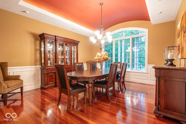 3104 E Chase Ln E, Bloomington, IN 47401 - dining area featuring a chandelier, hardwood / wood-style flooring, a wainscoted wall, and a decorative wall