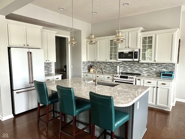 13895 Cloverfield Cir, Fishers, IN 46038 - kitchen featuring high end refrigerator, stainless steel microwave, electric stove, decorative backsplash, and a center island with sink
