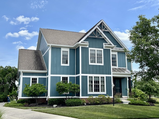 13895 Cloverfield Cir, Fishers, IN 46038 - view of front of home featuring a front yard, a shingled roof, board and batten siding, and a standing seam roof