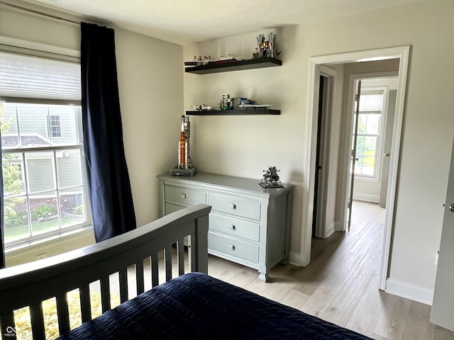 13895 Cloverfield Cir, Fishers, IN 46038 - bedroom featuring multiple windows and light wood-style flooring