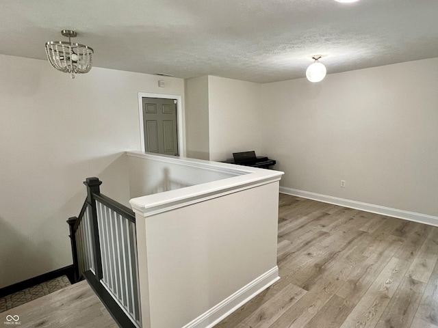 13895 Cloverfield Cir, Fishers, IN 46038 - interior space with wood finished floors, a chandelier, and a textured ceiling