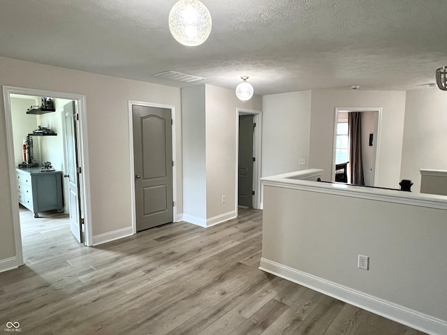 13895 Cloverfield Cir, Fishers, IN 46038 - empty room featuring wood finished floors and a textured ceiling