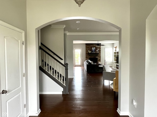 13895 Cloverfield Cir, Fishers, IN 46038 - foyer entrance with ornamental molding, wood finished floors, a ceiling fan, a stone fireplace, and stairs