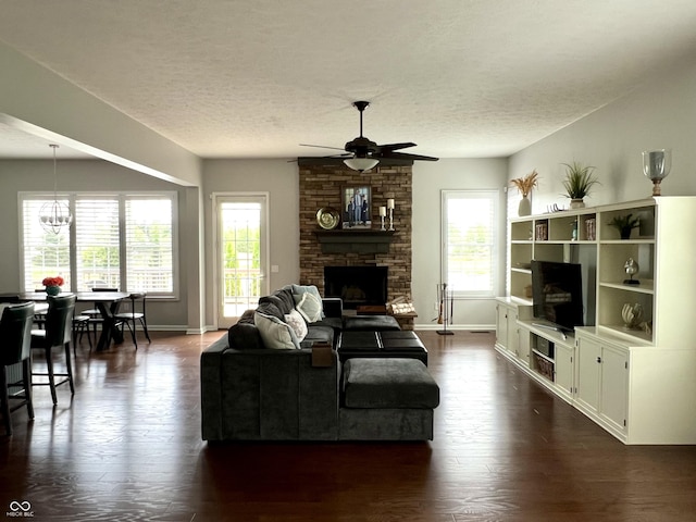 13895 Cloverfield Cir, Fishers, IN 46038 - living area featuring ceiling fan, dark wood-type flooring, a textured ceiling, and a fireplace