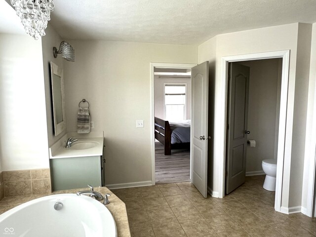 13895 Cloverfield Cir, Fishers, IN 46038 - ensuite bathroom featuring vanity, a bath, and tile patterned floors