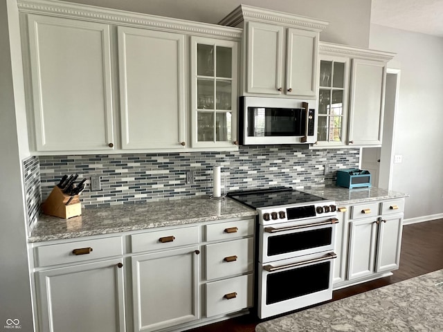 13895 Cloverfield Cir, Fishers, IN 46038 - kitchen featuring double oven range, dark wood finished floors, tasteful backsplash, and glass insert cabinets