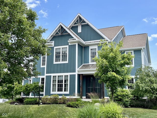 13895 Cloverfield Cir, Fishers, IN 46038 - view of front of home with a front lawn, board and batten siding, and roof with shingles