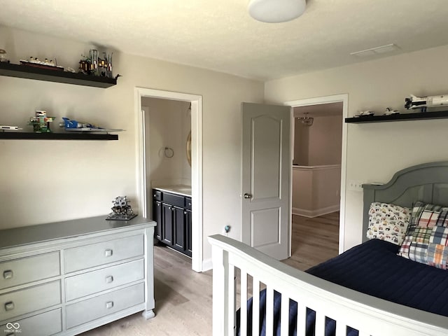 13895 Cloverfield Cir, Fishers, IN 46038 - bedroom with light wood-type flooring and ensuite bathroom