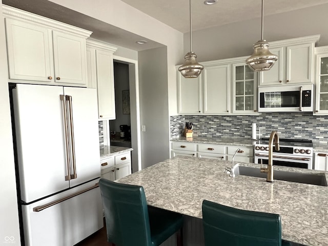 13895 Cloverfield Cir, Fishers, IN 46038 - kitchen with premium appliances, backsplash, glass insert cabinets, hanging light fixtures, and recessed lighting