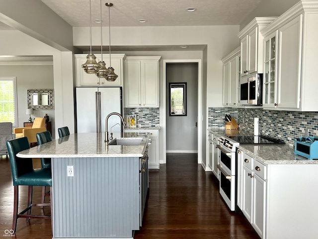 13895 Cloverfield Cir, Fishers, IN 46038 - kitchen featuring white appliances, a kitchen bar, tasteful backsplash, dark wood-style floors, and glass insert cabinets
