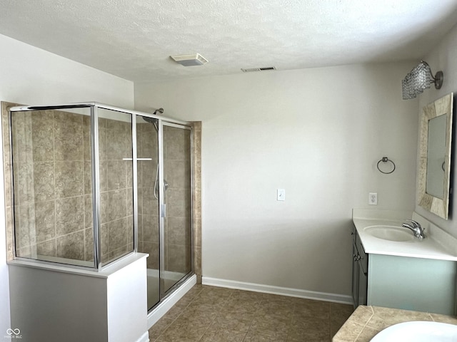 13895 Cloverfield Cir, Fishers, IN 46038 - bathroom featuring vanity, a shower stall, tile patterned floors, and a textured ceiling