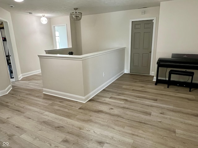 13895 Cloverfield Cir, Fishers, IN 46038 - empty room featuring wood finished floors and a chandelier