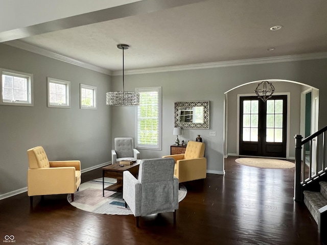 13895 Cloverfield Cir, Fishers, IN 46038 - sitting room featuring arched walkways, a chandelier, ornamental molding, wood finished floors, and french doors