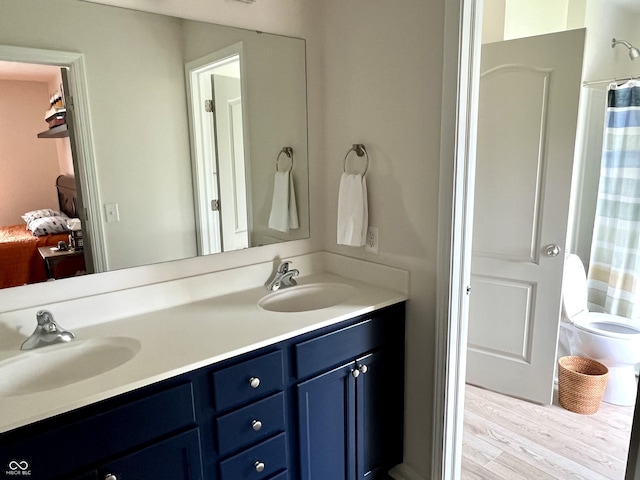 13895 Cloverfield Cir, Fishers, IN 46038 - bathroom with double vanity, wood finished floors, and curtained shower