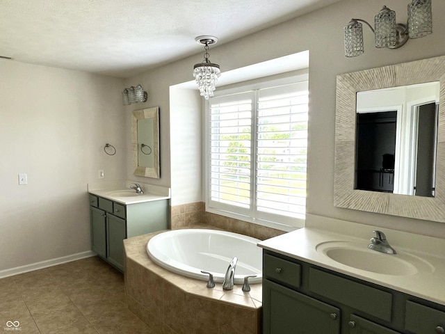 13895 Cloverfield Cir, Fishers, IN 46038 - bathroom with two vanities, a garden tub, tile patterned floors, and a chandelier