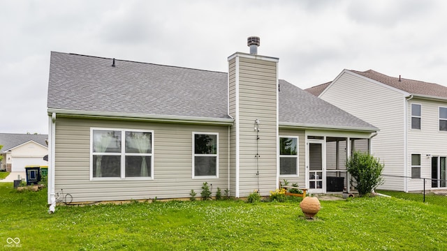3872 Dusty Sands Rd, Whitestown, IN 46075 - rear view of house featuring roof with shingles, a sunroom, and a chimney