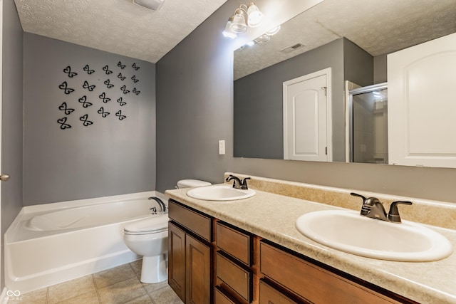 3872 Dusty Sands Rd, Whitestown, IN 46075 - bathroom with a textured ceiling, a garden tub, double vanity, a shower stall, and tile patterned floors