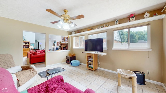 1067 Acadia Ct, Indianapolis, IN 46217 - living room with healthy amount of natural light, light tile patterned floors, and ceiling fan