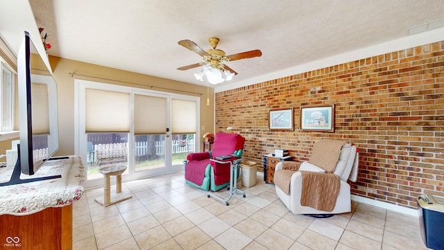 1067 Acadia Ct, Indianapolis, IN 46217 - living room with brick wall, a ceiling fan, and light tile patterned floors
