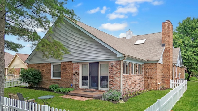 1067 Acadia Ct, Indianapolis, IN 46217 - back of house featuring brick siding, a fenced backyard, a chimney, and roof with shingles