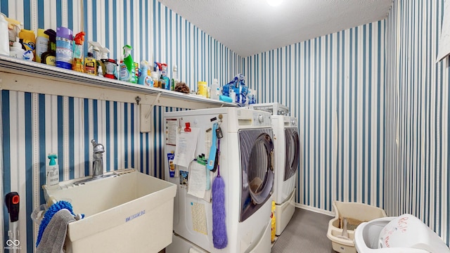 1067 Acadia Ct, Indianapolis, IN 46217 - laundry room featuring wallpapered walls, washer and dryer, carpet, and a textured ceiling