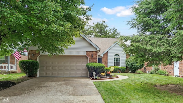 1067 Acadia Ct, Indianapolis, IN 46217 - view of front of home with brick siding, concrete driveway, a garage, and a front lawn