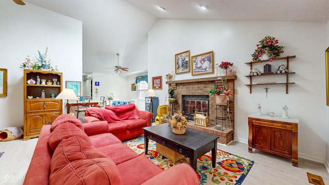 1067 Acadia Ct, Indianapolis, IN 46217 - living room featuring ceiling fan, light wood-style floors, a fireplace, and high vaulted ceiling