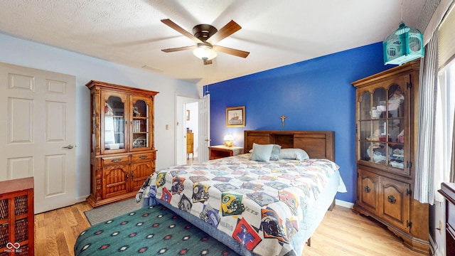 1067 Acadia Ct, Indianapolis, IN 46217 - bedroom with light wood finished floors and ceiling fan