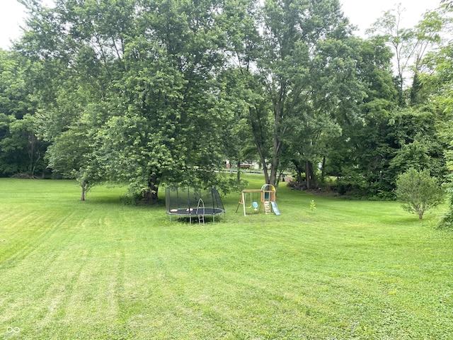 403 N College Ave, Greencastle, IN 46135 - view of green lawn featuring a trampoline and a playground