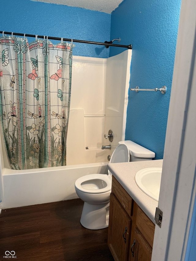 8113 Maple Stream Ln, Indianapolis, IN 46217 - bathroom with a textured wall, wood finished floors, shower / tub combo with curtain, and vanity