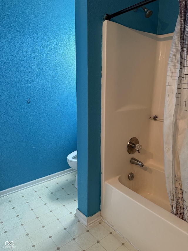 8113 Maple Stream Ln, Indianapolis, IN 46217 - bathroom featuring shower / tub combo, a textured wall, and tile patterned floors