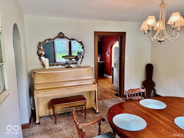 313 S Brittain Ave, Muncie, IN 47303 - dining space featuring arched walkways and a chandelier