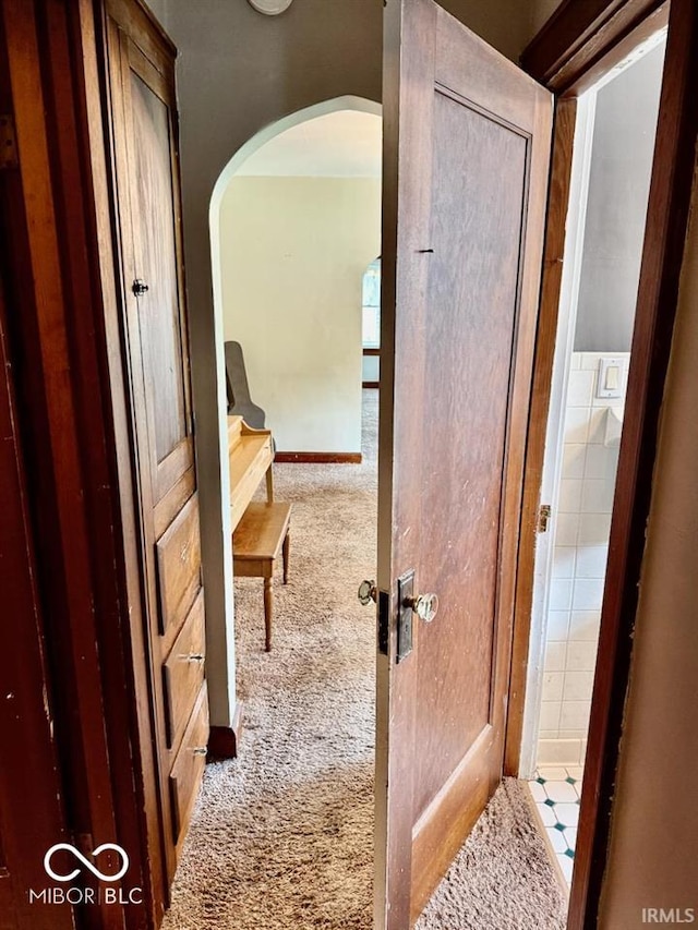 313 S Brittain Ave, Muncie, IN 47303 - hall with arched walkways and carpet flooring
