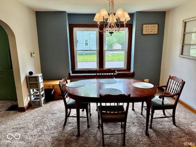 313 S Brittain Ave, Muncie, IN 47303 - dining room featuring arched walkways, plenty of natural light, and a chandelier