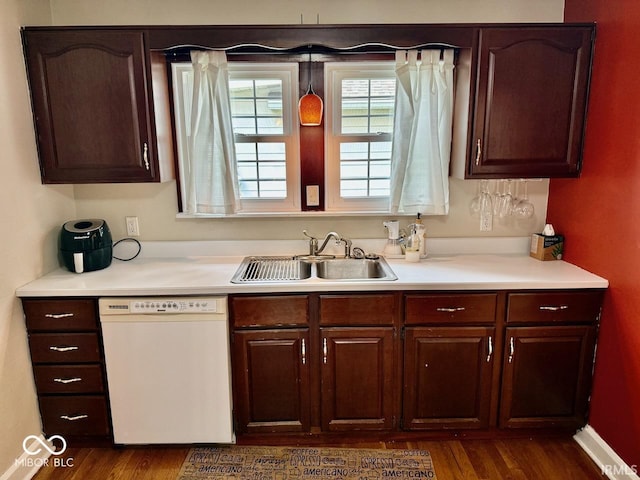 313 S Brittain Ave, Muncie, IN 47303 - kitchen with dishwasher, dark wood-type flooring, and light countertops